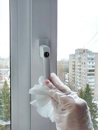 Recommendations for coronavirus disinfection: disinfect door handles, light switches, window handles, tables, and common areas.の写真素材