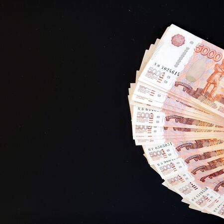 Cash on an isolated background. Russian banknotes spread out in a fan.の写真素材