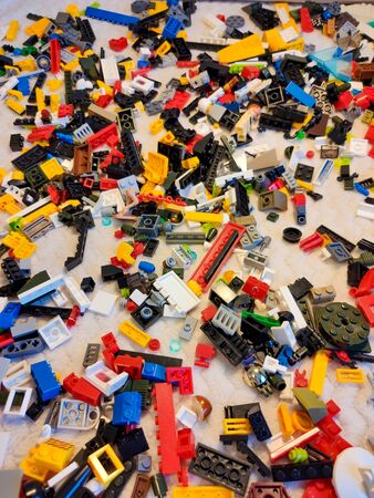 Many small parts from toy. Lots of colorful toy bricks. The background .の写真素材