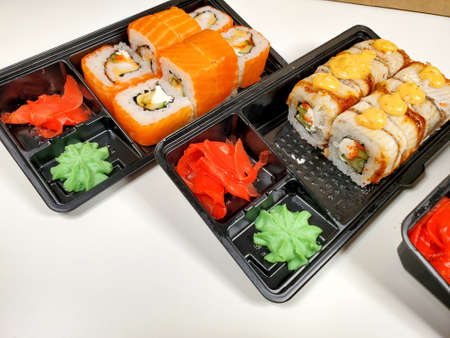 Assorted sushi rolls on an isolated white background. Delivery of Japanese cuisineの写真素材