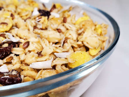 Muesli in a transparent plate close-up. breakfast.の写真素材
