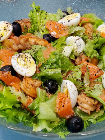 Close-up of a Greek salad with shrimp and fishの写真素材