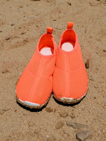 Womens shoes for swimming in the sea where the bottom is rocky, sea urchins and coralsの写真素材