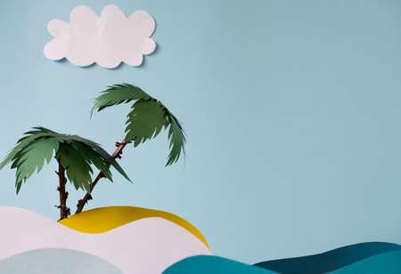 Two palm trees on a sandy island under the sun in the sea with paper waves.