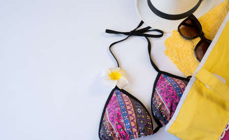 Flat lay with beach accessories on white paper background, place for text.の写真素材