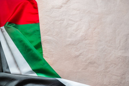 Happy Holidays. Female hands untie a bow on a gift box for Christmas in a white bedの写真素材