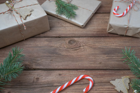Christmas decoration and gift boxes on wooden background. Space for text.の写真素材