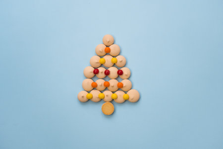 Christmas tree made of cookies and sweets on a blue background with space for text. Christmas baking conceptの写真素材
