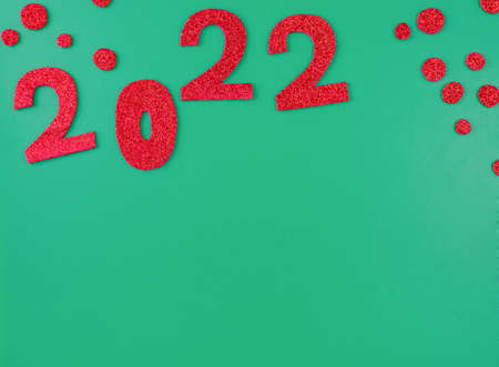 happy new year 2022 background new year holiday card on green background bright red numbers