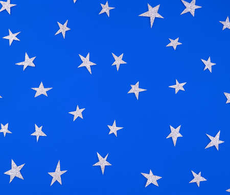 Blue background with silver stars. Patternの写真素材