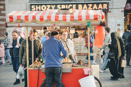 Istanbul, Turkey - May 02, 2023: Seller of roasted chestnuts and corn on the street in Istanbul.のeditorial素材