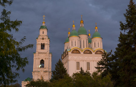 View of the Astrakhan Kremlin with the Assumption Cathedral and the bell tower late in the evening on a cloudy day. Astrakhan, Russiaの写真素材