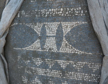 A fragment of a mosaic on the floor in the ruins of the ancient city of Phaselis in Lycia in modern Turkey on the shores of the Mediterranean Sea.の写真素材