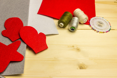 Making handmade toy toys from felt by one's own hands. Children's concept. Cut out details for the manufacture of toys. Winter holidays.の写真素材