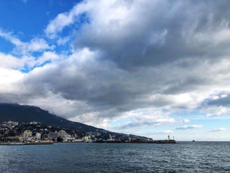 Beautiful view of the mountains and the sea. Gulls fly over the water. Crimean mountains and the black seaの写真素材