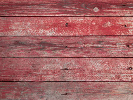 The surface of a red wooden table. Wall texture background. old wood backgroundの写真素材