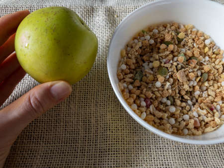 Healthy cereals, muesli on the table in a plate. Muesli on a plate top view. healthy eating. healthy breakfast. vegetarian foodの写真素材