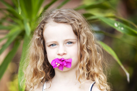 portrait of a little girl with flowerの写真素材