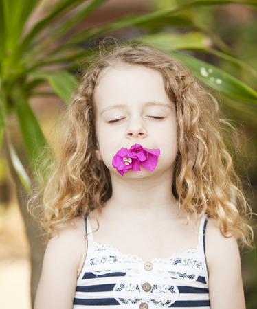 portrait of a little girl with flowerの写真素材