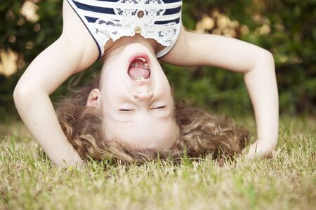 curly girl upside downの写真素材