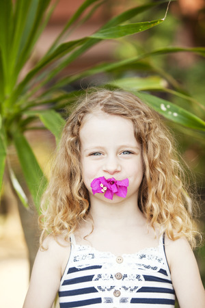 portrait of a little girl with flowerの写真素材