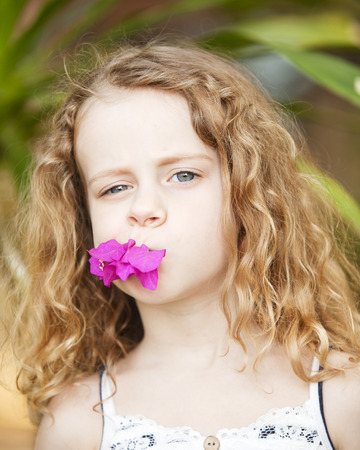 portrait of a little girl with flowerの写真素材