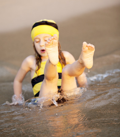 the little girl at the beach sunsetの写真素材