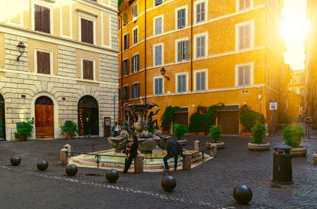 Old square with fountain in Rome, Italyの写真素材