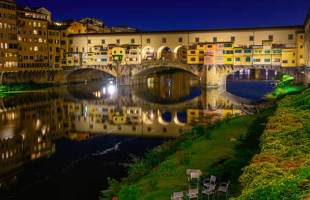 Night view of Ponte Vecchio over Arno River in Florence, Italyの写真素材