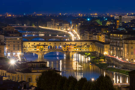 Night view of Ponte Vecchio over Arno River in Florence, Italyの写真素材