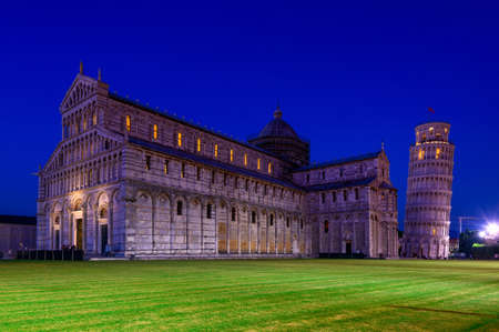 Night view of Pisa Cathedral (Duomo di Pisa) with the Leaning Tower of Pisa (Torre di Pisa) on Piazza dei Miracoli in Pisa, Tuscany, Italyの写真素材