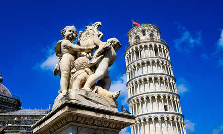 Fontana dei Putti and Leaning Tower of Pisa in Piazza dei Miracoli (Square of Miracles) in Pisa, Tuscany, Italyの写真素材