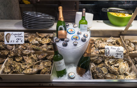 Madrid - May 10: Stall with oysters in Mercado San Miguel on May 10, 2016 in Madrid, Spain. Mercado San Miguel of Madrid is one of the most popular landmark in Madrid, Spain.のeditorial素材