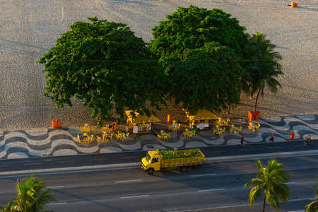 Morninig view of Copacabana beach and Avenida Atlantica with truck with coconuts in Rio de Janeiro, Brazilの写真素材