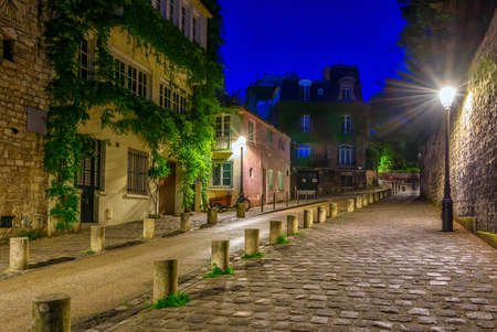 Night view of cozy street in quarter Montmartre in Paris, Franceの写真素材