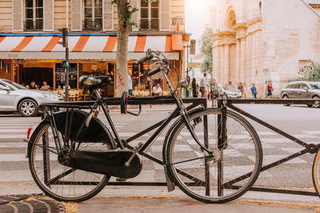Old bicycle parked on Boulevard Saint-Germain in Paris, Franceの写真素材