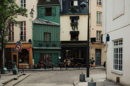 Typical view of the Parisian street with tables of cafe in Paris, France.の写真素材