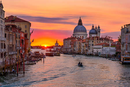 Grand Canal with Basilica di Santa Maria della Salute in Venice, Italy. Sunrise view of Venice Grand Canal. Architecture and landmarks of Venice. Venice postcardの写真素材