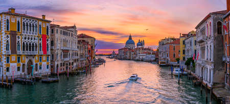 Grand Canal with Basilica di Santa Maria della Salute in Venice, Italy. Sunrise view of Venice Grand Canal. Architecture and landmarks of Venice. Venice panoramaの写真素材