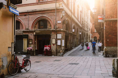 Old narrow street in Bologna, Emilia Romagna, Italyの写真素材
