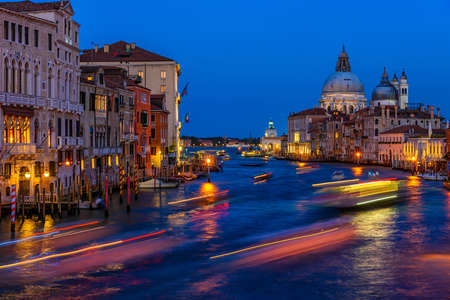 Grand Canal with Basilica di Santa Maria della Salute in Venice, Italy. Night view of Venice Grand Canal. Architecture and landmarks of Venice. Venice postcardの写真素材