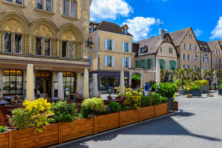 Old street with old houses and tables of cafe in a small town Chartres, Franceの写真素材