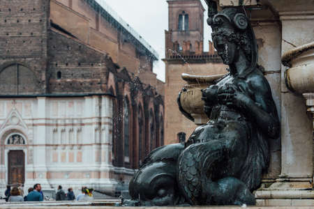 Detail with a lactating nereid of Fountain of Neptune (Fontana di Nettuno) located in Piazza del Nettuno in Bologna, Italy. Architecture and landmark of Bologna. Cityscape of Bologna.の写真素材