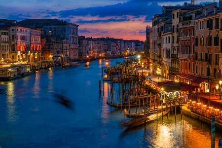 Grand Canal with gondolas in Venice, Italy. Sunset view of Venice Grand Canal. Architecture and landmarks of Venice. Venice postcardの写真素材