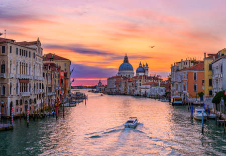 Grand Canal with Basilica di Santa Maria della Salute in Venice, Italy. Sunrise view of Venice Grand Canal. Architecture and landmarks of Venice. Venice panoramaの写真素材