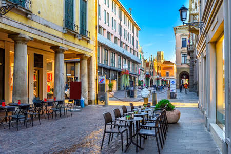 Old street with tables of pizzeria in Padua (Padova), Veneto, Italyの写真素材