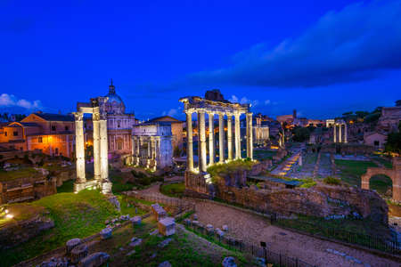 Night view of Temple of Saturn and Forum Romanum in Rome, Italyの写真素材