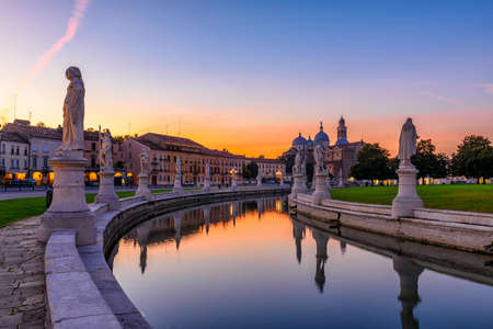 View of canal with statues on square Prato della Valle and Basilica Santa Giustina in Padova (Padua), Veneto, Italy.の写真素材