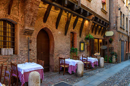 Cozy street with old houses in Ferrara, Emilia-Romagna, Italy. Ferrara is capital of the Province of Ferrara.の写真素材