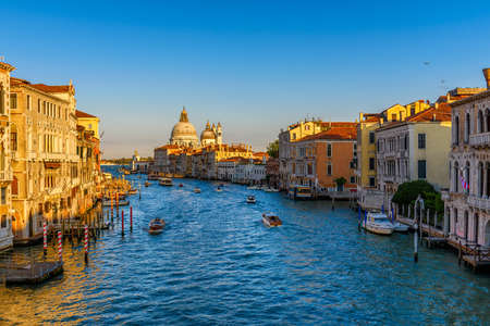 Grand Canal with Basilica di Santa Maria della Salute in Venice, Italy. View of Venice Grand Canal. Architecture and landmarks of Venice. Venice postcardの写真素材